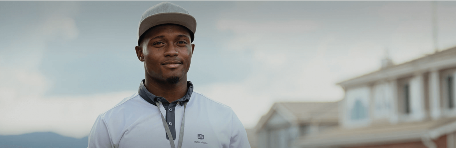 Vivint Smart Home Pro in a white shirt and hat