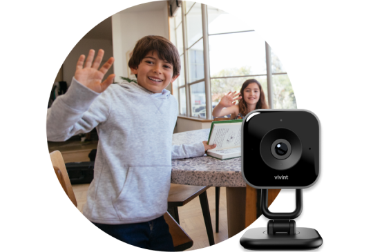 Two kids waving at the Vivint Indoor Camera Pro and product image of the indoor camera